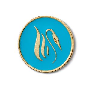 A gold Erget in teal pool etched in gold circle. 
